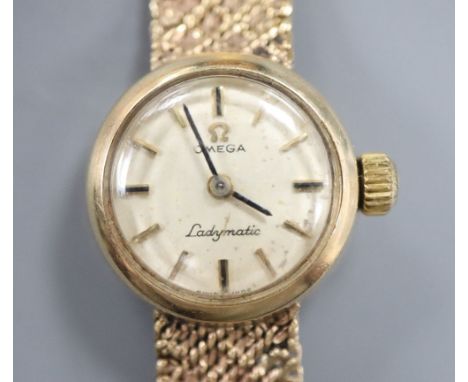 A 9ct gold lady's Omega gold manual wind wristwatch on 9ct gold bracelet, overall length 17.8cm, gross 23.8 grams.CONDITION: 