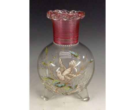A 19th century Stourbridge glass three-footed vase, painted in enamel with a dove among a floral backdrop, red trailed glass 