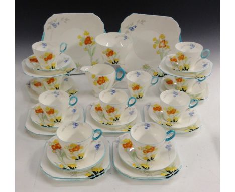 A Shelley Bone China Siberian Wall Flower pattern Regent shape tea service,  comprising ten cups, eleven saucers, eleven side