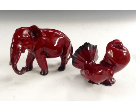 A Royal Doulton flambe elephant, trunk down. 10cm high,  printed marks; another, of a pair of Doves, 10cm high, printed mark 