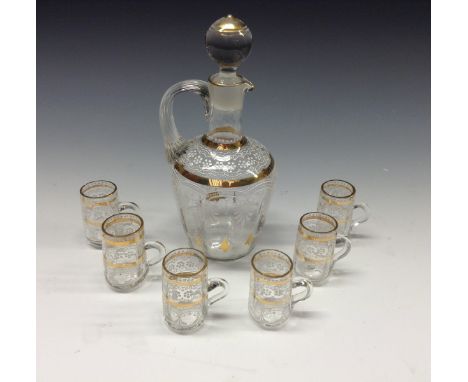 An Edwardian enamelled glass spirit decanter set, comprising decanter and six diminutive handled glasses, painted with white 