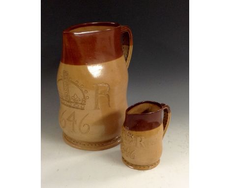 A large Doulton Lambeth salt glazed stoneware two quart jack, in brown and buff, stitched leather effect detailing, incised w