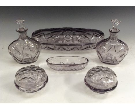 An Orrefors glass dressing table set, designed by Simon Gate, comprising a large oval covered pin dish, one smaller (without 