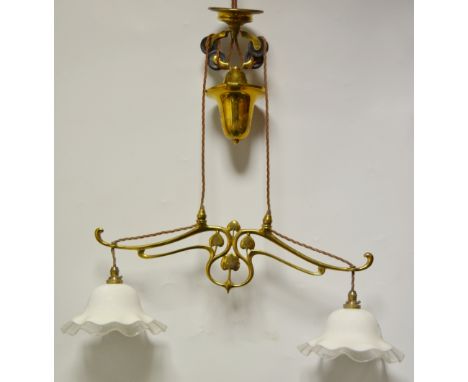 An Art Nouveau gilt brass two-branch. two-light light fitting, the sinuous Art Nouveau arms with stylised leaves, the white g