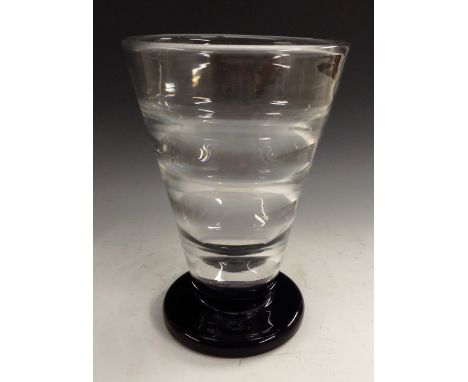 An Orrefors spreading ovoid glass vase, designed by Vicke Lindstrand, clear ribbed glass, black circular foot, 21.5cm high, s