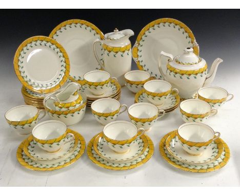 A Royal Doulton Keble pattern tea service, for eleven, the border with stylised flowers, yellow and green, comprising teapot 