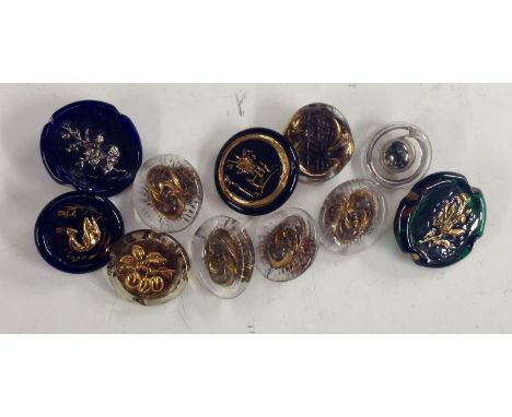 A set of four Bimini type oval glass buttons, gilded and cased;  a large green glass Bimini type glass button, moulded and gi