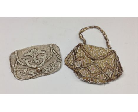 An Art Deco beaded evening bag, with faux pearl clasp, fabric lined, c.1920s;  another, similar, with push button fastening (