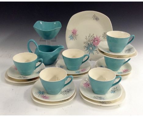 A Midwinter Stylecraft Fashion Shape Quite Contrary pattern tea set printed with stylised starbursts in pink, grey and blue, 