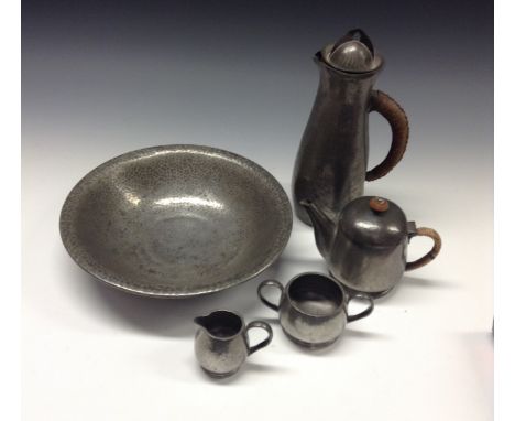 Tudric Pewter -  a Liberty & Co Tudric pewter hot water jug and cover,  hammered, woven loop  handle, 25.5cm high, no.0232;  