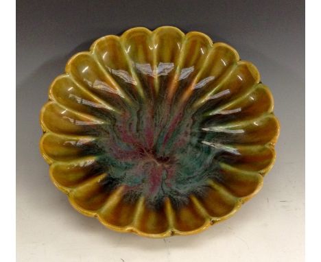A Linthorpe lobed circular dish, of Japanese inspiration, designed by Dr Christopher Dresser (1834-1904), the central reserve