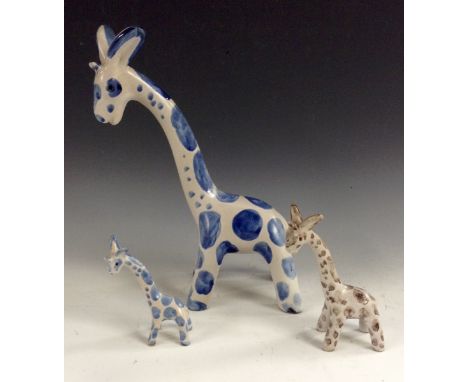 A Bourne Denby Danesby Ware novelty animal family, large medium and small giraffe, brown and blue patch markings, 24cm - 8.75