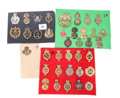 Restrike badges: Victorian Royal Artillery helmet plate; 1855-1861 shako plate of the 88th Regt; 21 pre-1881 glengarry badges