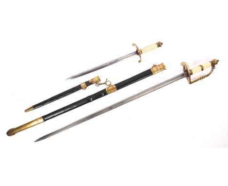 A replica of a Georgian naval officer's 5 ball sword, brass hilt in its leather scabbard together with companion similar dirk
