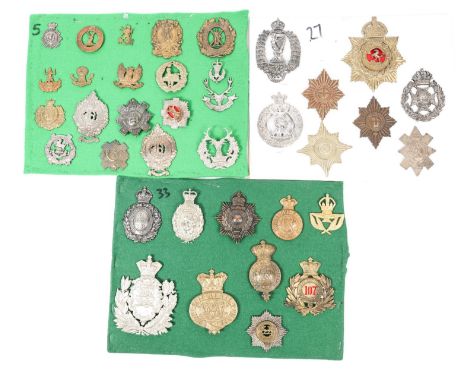 36 restrike helmet plates, shako plates, glengarry badges, etc, including West Kent OR's helmet plate, Royal Irish Rifles pou