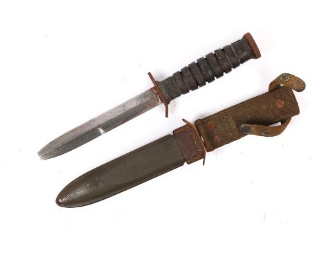 A WWII US fighting knife M3, in its M8 scabbard marked "B.M. Co", GC (blade tip missing). £50-70