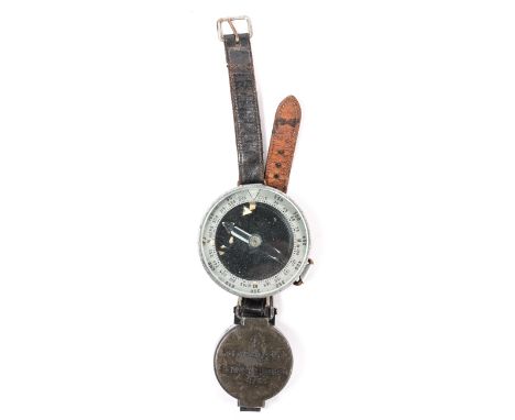A WWII period Russian wrist compass, with aluminium and bakelite case and leather strap, GC, the luminous paint flaked off th