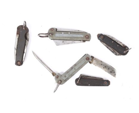 Five WWI/WWII British military penknives: two with single broad blade and spike and chequered grey metal side scales, one of 