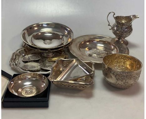 A collection of silverware including an Armada dish, two waiters, two pierced bon-bon dishes, a triangular pin tray, four spi