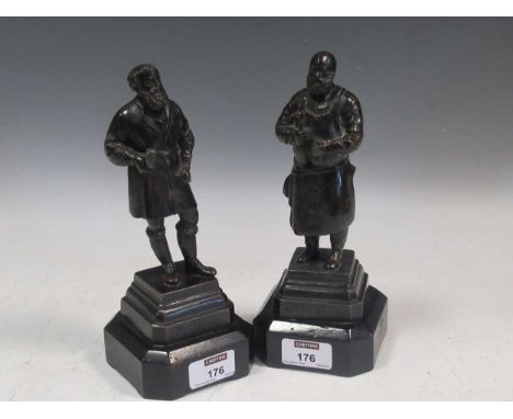 A pair of small bronze figures of artisans, on wooden socles