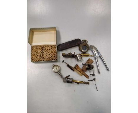 A collection lot to include a trephine circular crown saw, a pair of folding field glasses incorporating a compass, a cutting