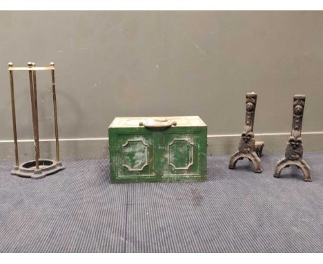 A 19th century iron stongbox 32 x 53 x 35cm together with a pair of fire dogs and a circular stick stand (4)