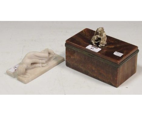 A hardstone cigar box with ivory finial and small marble carving of child lying down