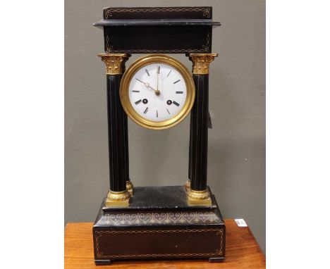 A French 19th century ebonised portico clock, of typical form, with gridiron pendulum