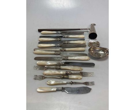 A pair of silver grape scissors, a silver spirit label, a punch ladle bowl, some silver and silver plated cutlery and flatwar