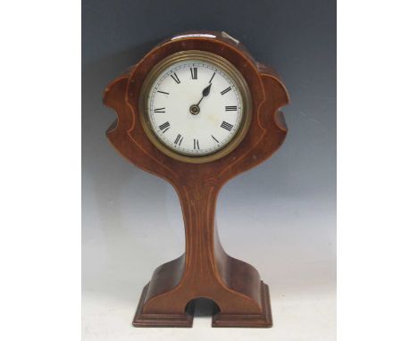 An Art Nouveau mahogany and inlaid cased mantle clock