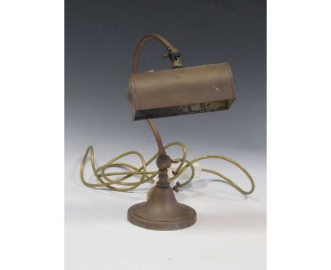 A 20th century brass desk lamp, with a curved stem raised on a circular base, 33cm high