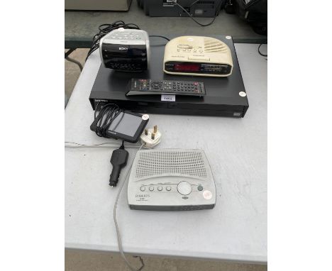 A SAMSUNG DVD PLAYER, A GARMIN SAT NAV TOGETHER WITH THREE CLOCK RADIOS, IN WORKING ORDER 