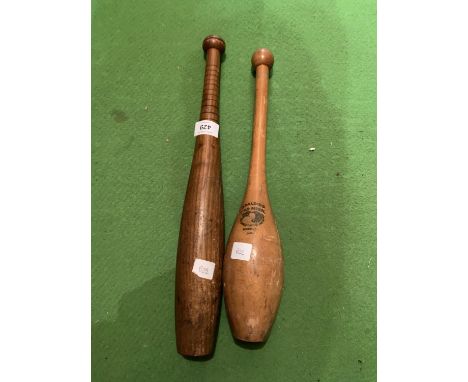 A SPALDING GOLD MEDAL BASEBALL BAT AND A WOODEN JUGGLING STICK 