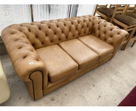 A LIGHT TAN LEATHER THREE SEATER CHESTERFIELD SOFA WITH BUTTON BACK AND ARMS 