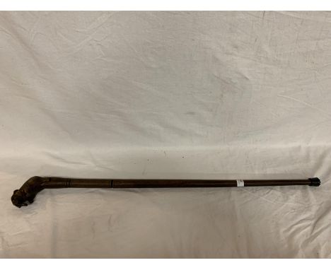 AN ELEPHANT TOPPED WALKING STICK 