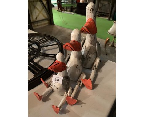 A GRADUATED SET OF THREE VINTAGE STYLE WOODEN WHITE PAINTED DUCKS SHELF PUPPETS 