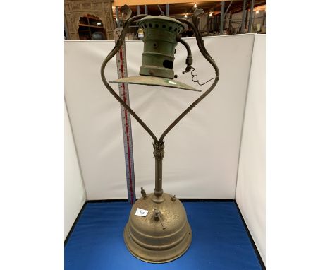 A VINTAGE BRASS UNIC LUMINERE LAMP WITH GREEN INAMEL SHADE 