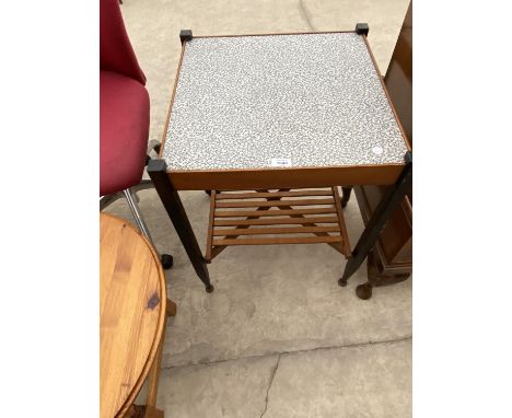 A RETRO COFFEE TABLE WITH FORMICA TOP AND LOWER SLATTED SHELF 