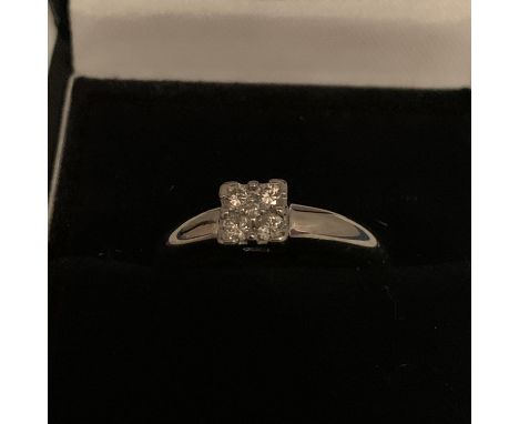 18CT HALLMARKED WHITE GOLD DIAMOND SET QUAD DESIGN RING SIZE Q. TOTAL GROSS WEIGHT 4.4 GRAMS 
