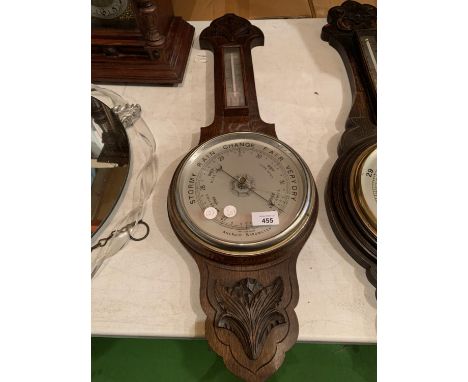 A WOODEN CASED BAROMETER (SLIGHTLY A/F) 