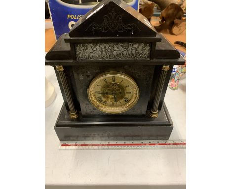 AN ORNATE SLATE MANTLE CLOCK 