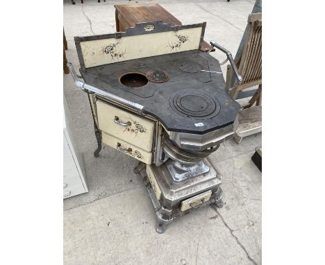 A VINTAGE FRENCH CAST RANGE COOKER WITH ENAMEL PANELS AND DOORS 