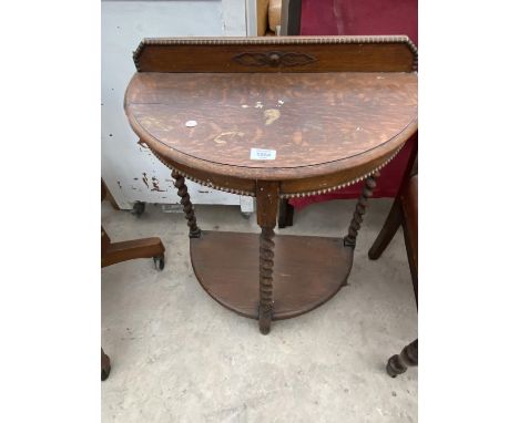 AN OAK DEMI LUNE HALL TABLE WITH LOWER SHELF 