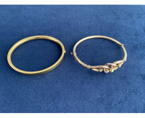 TWO VINTAGE ROLLED GOLD BANGLES ONE WITH A CELTIC KNOT 