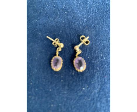 9CT GOLD AMETHYST OVAL DROP EARRINGS. TOTAL GROSS WEIGHT APPROX 2 GRAMS 