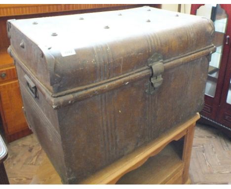 A tin travelling trunk