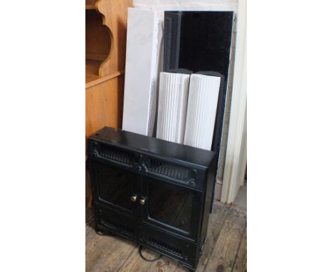 A Dimplex electric fire and moulded plaster and marble effect fire surround
