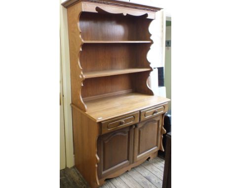 A modern light Oak shelf backed dresser