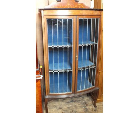 An Edwardian inlaid Mahogany lead glazed bow front china display cabinet