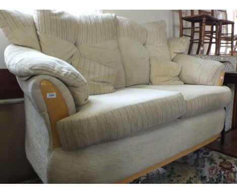 A nearly new modern cream upholstered two seater sofa